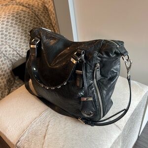 Michael Kors leather purse with cross body strap and side pockets